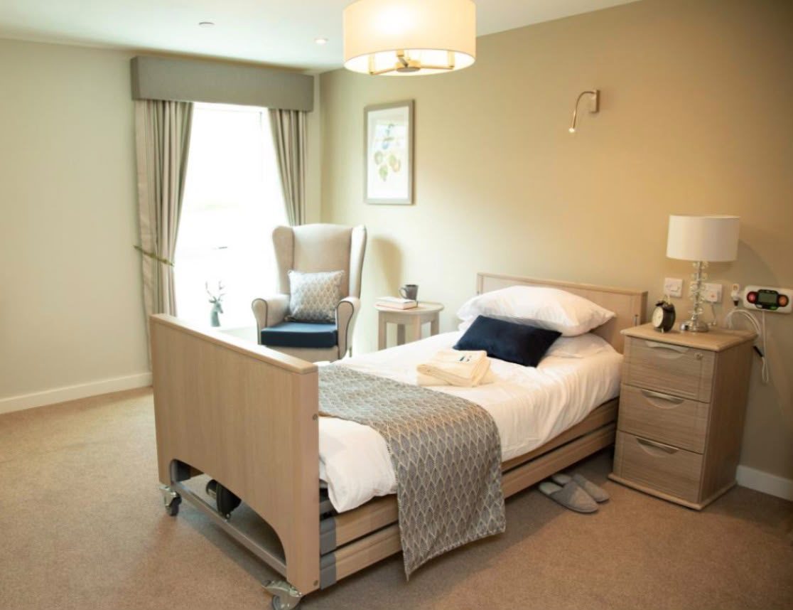 Single bed with mattress, bedside cabinet and wingback chair